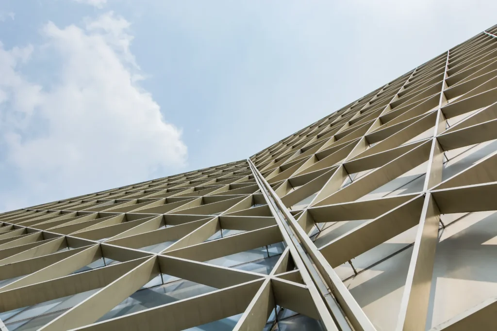Compressed metal structure with sky background